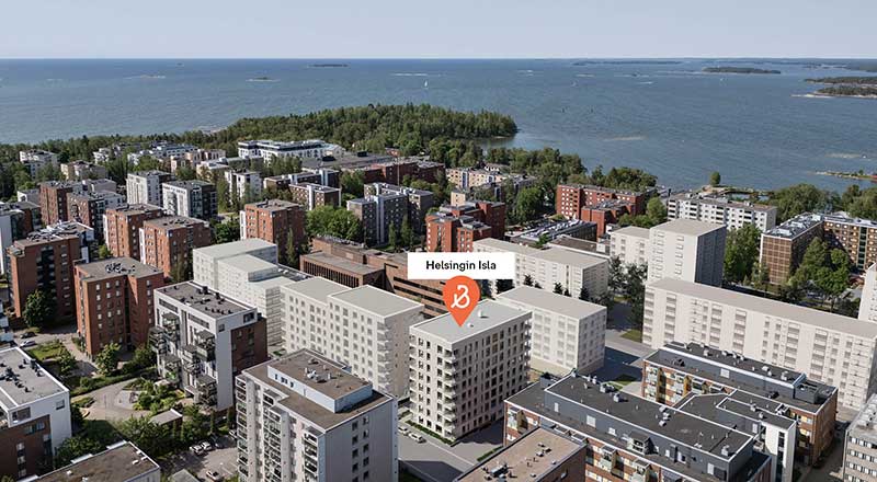 Helsingin Isla Ilmakuva Lauttasaaresta: Helsingin Islan asuinkohde merellisessä ympäristössä, ympärillä kerrostaloja ja taustalla saaristo ja avomeri.