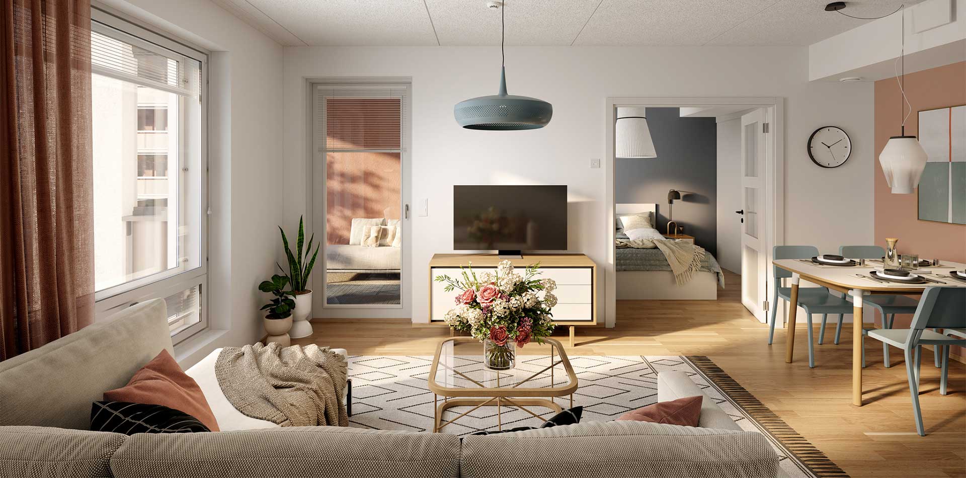 Moderni ja kodikas olohuone, jossa on vaalea sohva koristetyynyineen, lasinen sohvapöytä kukka-asetelmalla sekä televisio senkin päällä. Olohuoneesta avautuu näkymä ruokailutilaan, jossa on pyöreä ruokapöytä ja sinisävyiset tuolit, sekä makuuhuoneeseen, jossa on harmonisesti sisustettu sänky. Suuret ikkunat ja parvekkeen ovi tuovat tilaan runsaasti luonnonvaloa.