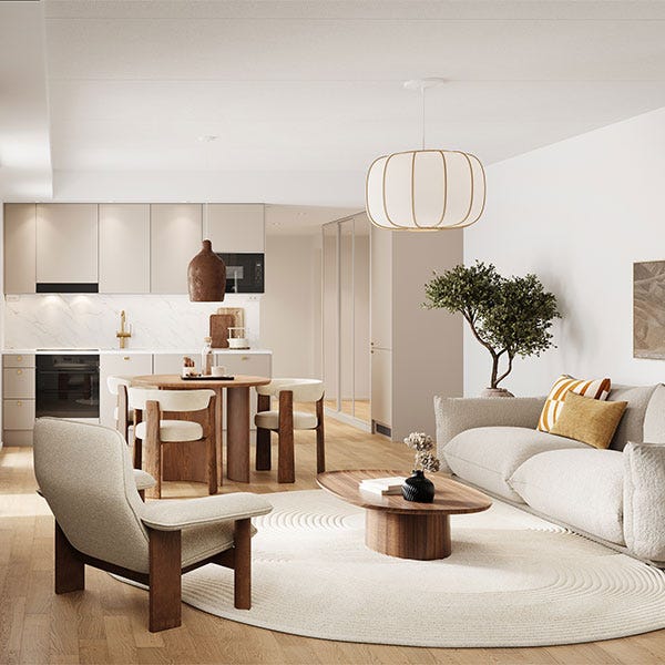 Harmoninen olohuone-keittiö, jossa on luonnonmateriaaleja, vaaleita sävyjä ja puisia huonekaluja sekä suuri pyöreä matto.