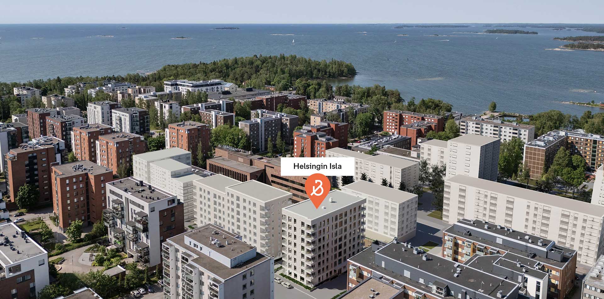 Ilmakuva Helsingin Islan korttelista meren rannalla, ympärillä kerrostaloja ja vehreää rantamaisemaa.